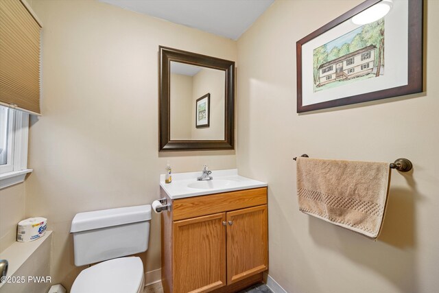 414 Leisure Loop, Milford, PA 18337 - bathroom with toilet, vanity, and baseboards