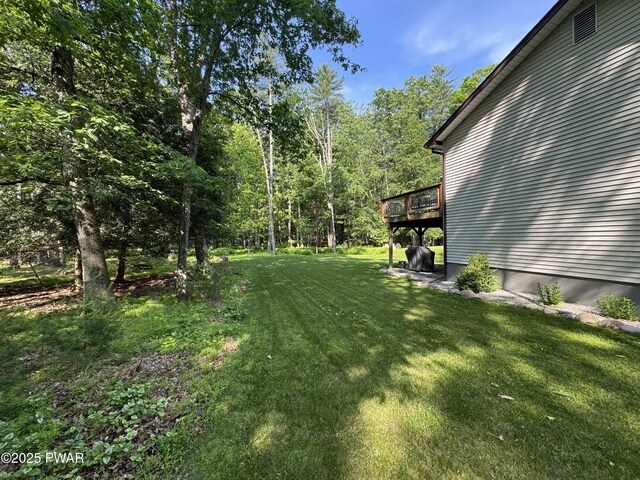 414 Leisure Loop, Milford, PA 18337 - view of green lawn with a deck