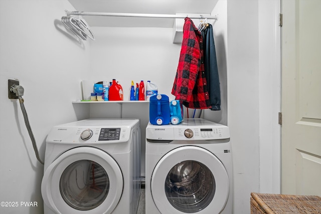 clothes washing area with laundry area and washing machine and clothes dryer