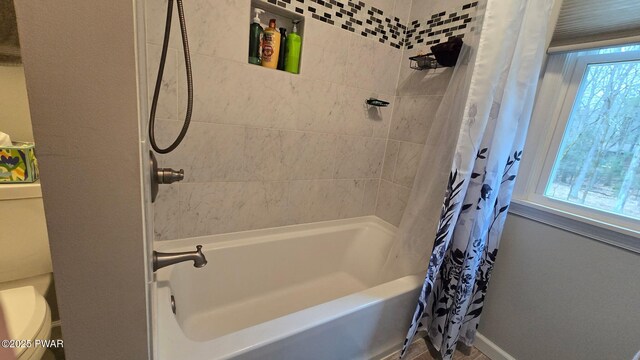414 Leisure Loop, Milford, PA 18337 - bathroom with shower / bath combo, toilet, and baseboards