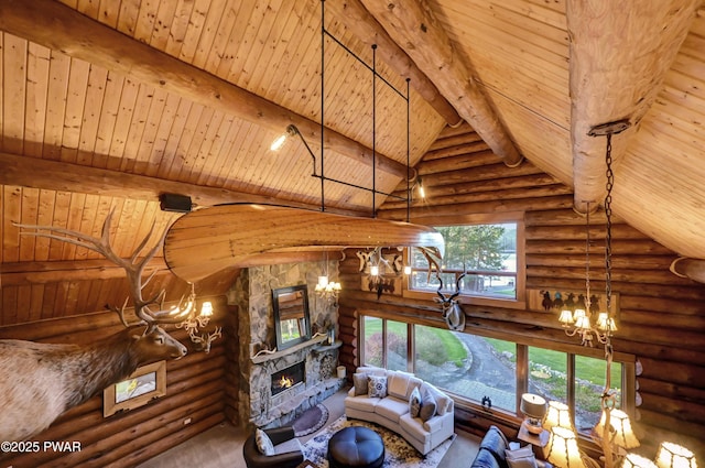 living area with an inviting chandelier, wooden ceiling, a fireplace, and log walls