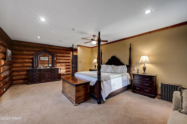 bedroom with log walls, recessed lighting, and light colored carpet
