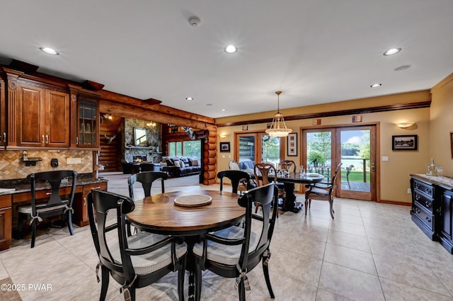 dining area with light tile patterned floors, log walls, french doors, and recessed lighting
