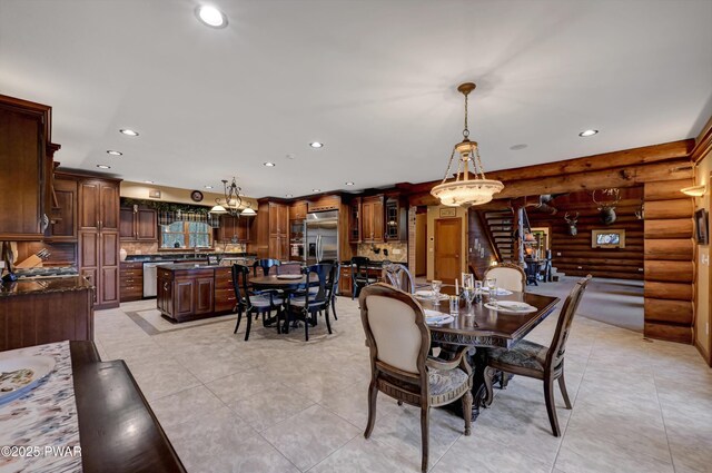 dining area featuring recessed lighting, rustic walls, and light tile patterned floors