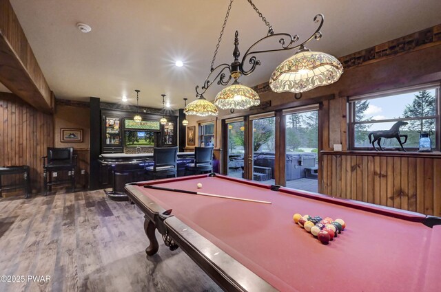 playroom featuring wood finished floors, wood walls, and pool table