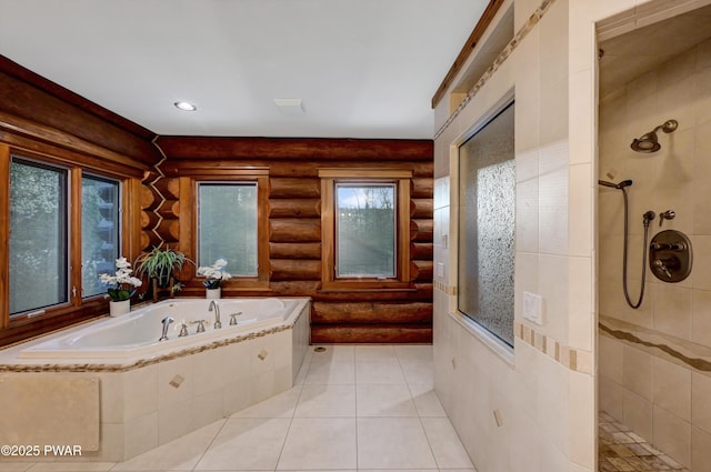 full bathroom featuring a garden tub, rustic walls, a wealth of natural light, and tiled shower