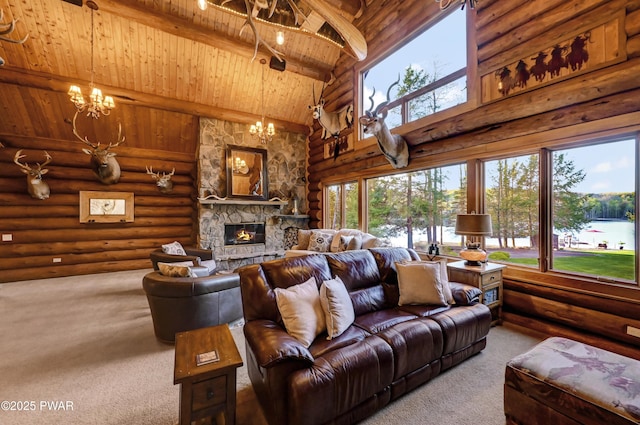 carpeted living room with a healthy amount of sunlight, wood ceiling, beam ceiling, and a chandelier