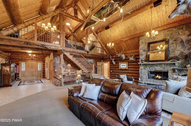 living room with wood ceiling, a notable chandelier, high vaulted ceiling, and stairway