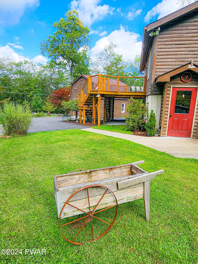 view of yard featuring a wooden deck