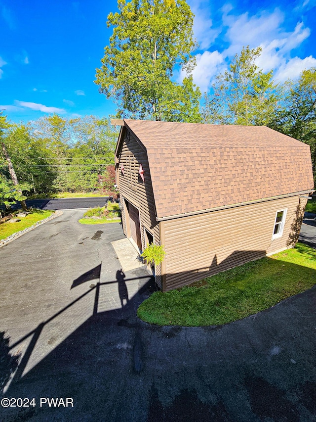 view of side of property featuring a garage