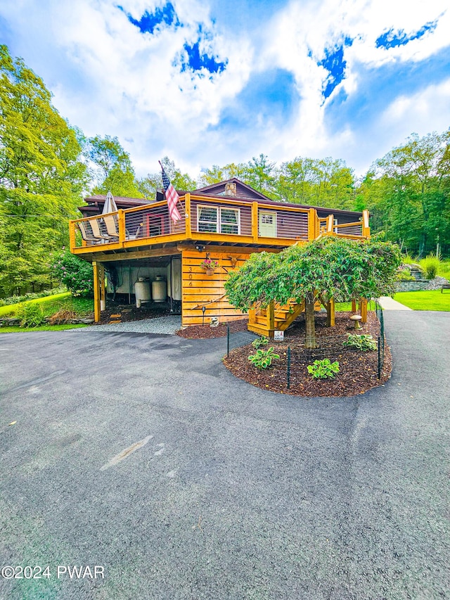 view of front of property with a wooden deck