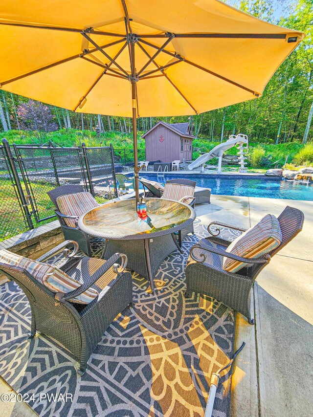 view of patio featuring a shed