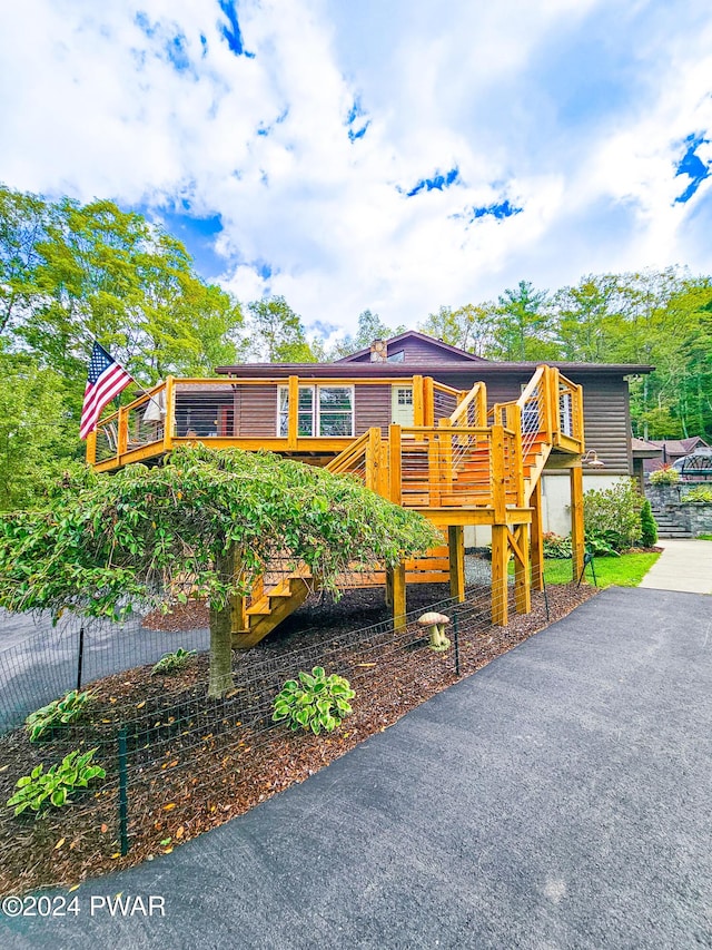 view of front of property with a wooden deck