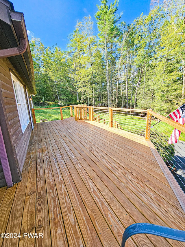 deck featuring a yard