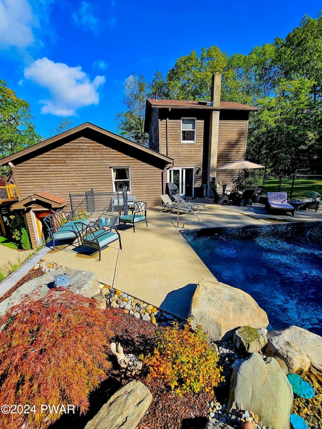 rear view of house featuring a patio