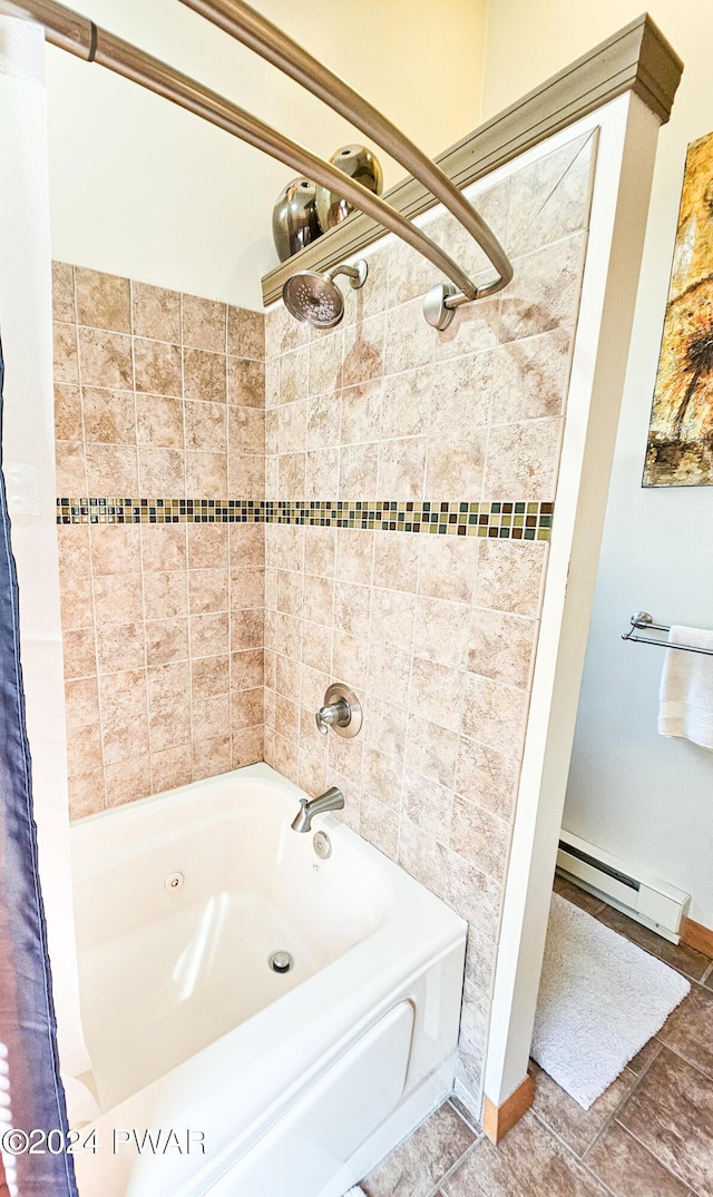 bathroom with tile patterned floors, tiled shower / bath, and a baseboard heating unit