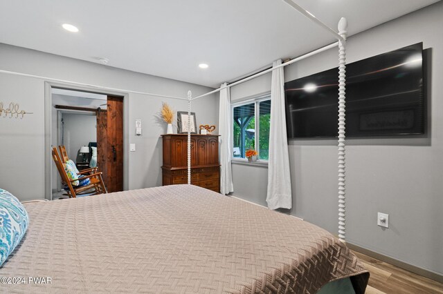 bedroom featuring hardwood / wood-style floors