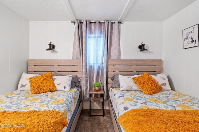 carpeted bedroom with wood walls and a textured ceiling