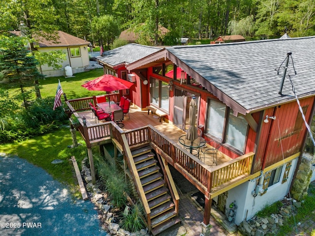 exterior space with a yard and stairway