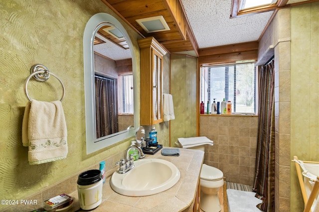 full bath featuring toilet and vanity