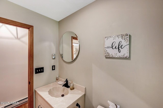 bathroom featuring vanity and a baseboard heating unit