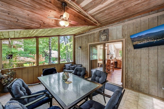 sunroom / solarium with wood ceiling, ceiling fan, and beamed ceiling