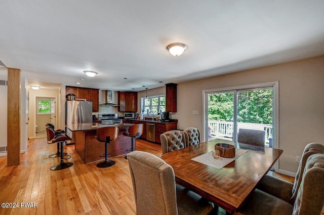 dining room featuring light hardwood / wood-style floors and sink