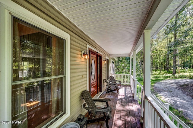 wooden terrace featuring a porch