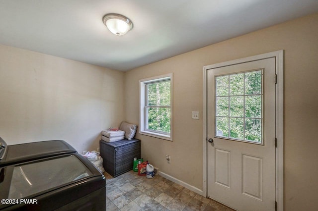 laundry area featuring a wealth of natural light and washer and clothes dryer