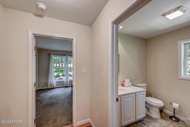 bathroom featuring vanity and toilet