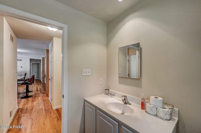 bathroom featuring hardwood / wood-style floors and vanity