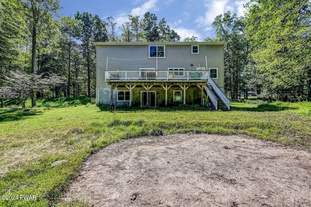 rear view of property featuring a wooden deck