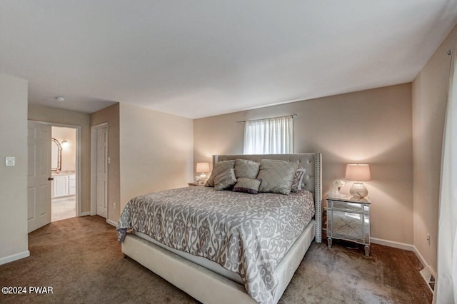 bedroom featuring carpet floors and connected bathroom