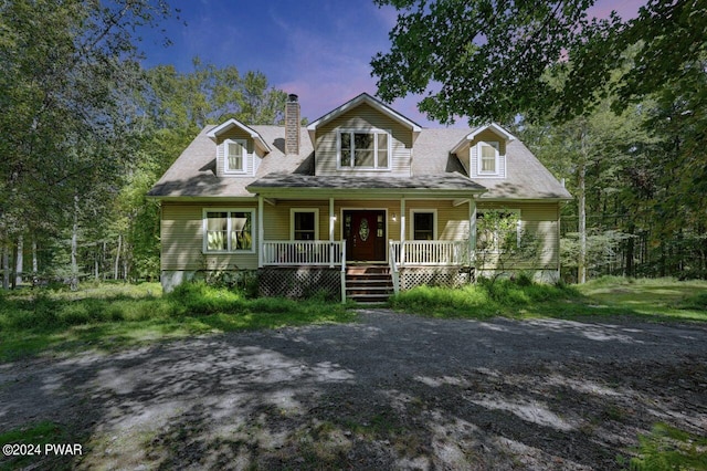 cape cod home with covered porch