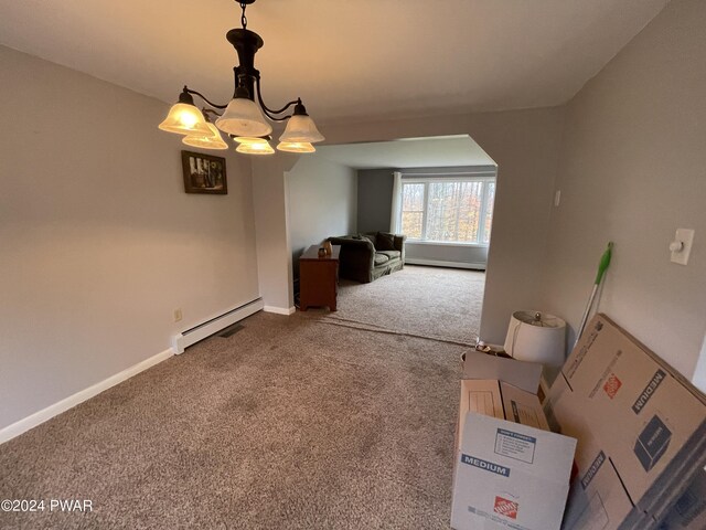 interior space with a kitchen bar, kitchen peninsula, and a baseboard heating unit