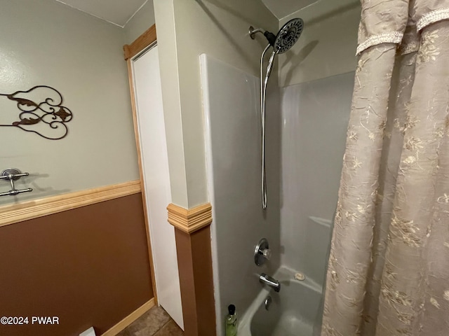 bathroom featuring tile patterned floors and shower / tub combo