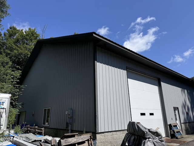 view of home's exterior featuring a garage and an outdoor structure