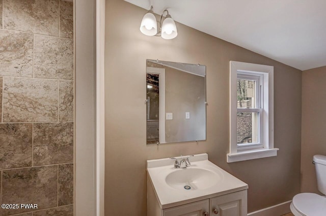 110 Maple Dr, Greentown, PA 18426 - bathroom with baseboards, toilet, vanity, and vaulted ceiling