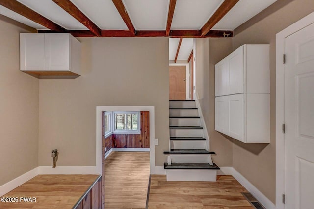 110 Maple Dr, Greentown, PA 18426 - staircase featuring visible vents, beam ceiling, wood finished floors, and baseboards