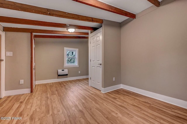 110 Maple Dr, Greentown, PA 18426 - unfurnished room with baseboards, light wood-type flooring, heating unit, and beamed ceiling