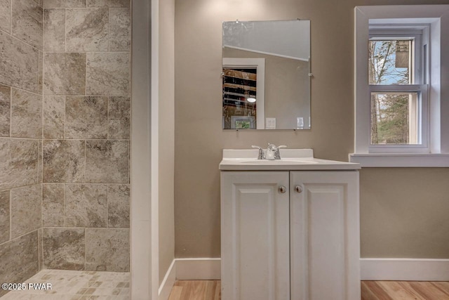 110 Maple Dr, Greentown, PA 18426 - full bath with wood finished floors, vanity, tiled shower, and baseboards