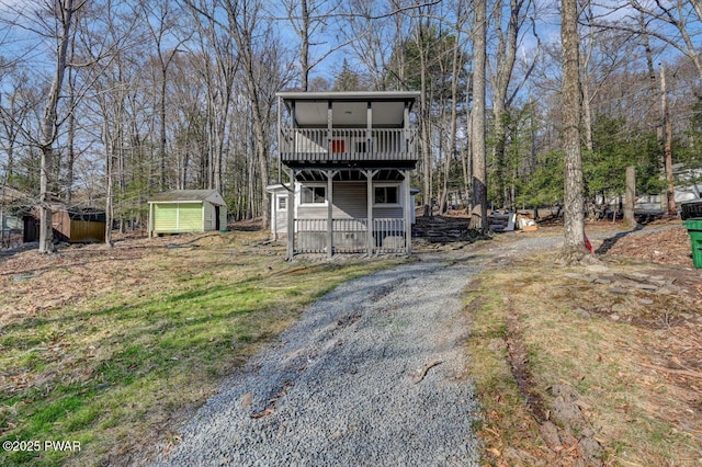 110 Maple Dr, Greentown, PA 18426 - chalet / cabin with a wooden deck, an outbuilding, and a storage shed