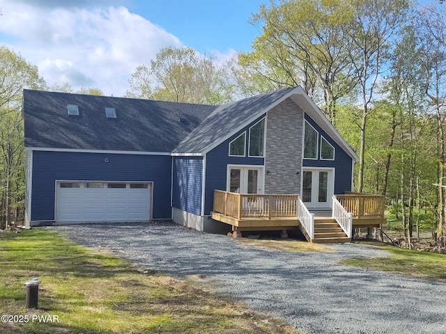 4409 Middleton Dr, Milford, PA 18337 - view of front of property featuring a garage, a deck, french doors, driveway, and a shingled roof