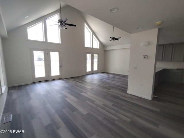4409 Middleton Dr, Milford, PA 18337 - unfurnished living room with a ceiling fan, high vaulted ceiling, baseboards, french doors, and dark wood finished floors