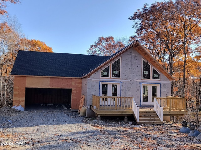 view of front of house featuring a deck and french doors