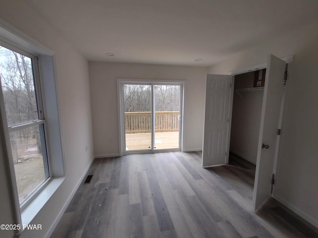 4409 Middleton Dr, Milford, PA 18337 - unfurnished bedroom featuring access to outside, wood finished floors, and baseboards