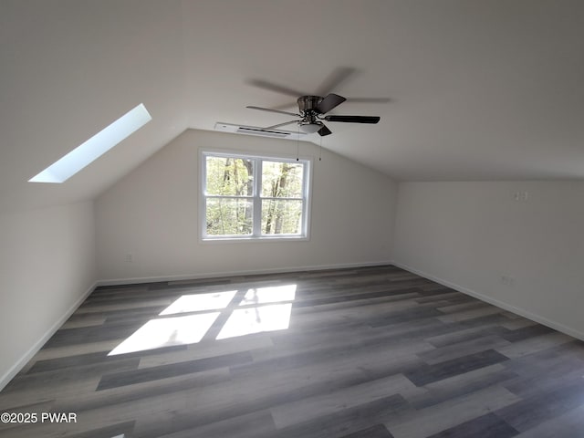 4409 Middleton Dr, Milford, PA 18337 - bonus room with a skylight, wood finished floors, baseboards, vaulted ceiling, and a ceiling fan