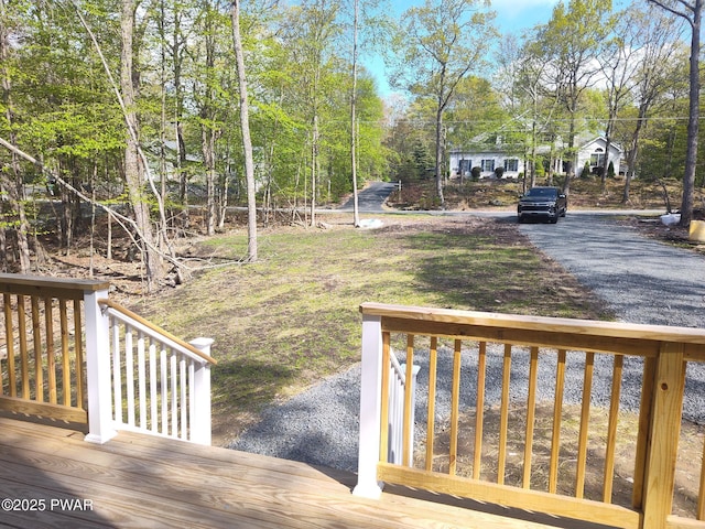 4409 Middleton Dr, Milford, PA 18337 - view of yard with a deck, asphalt driveway, and view of wooded area