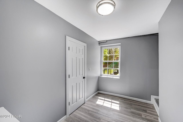 empty room with light hardwood / wood-style floors