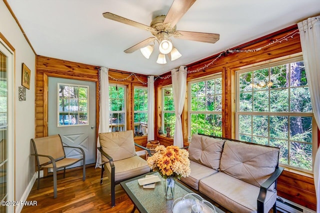 sunroom / solarium with ceiling fan